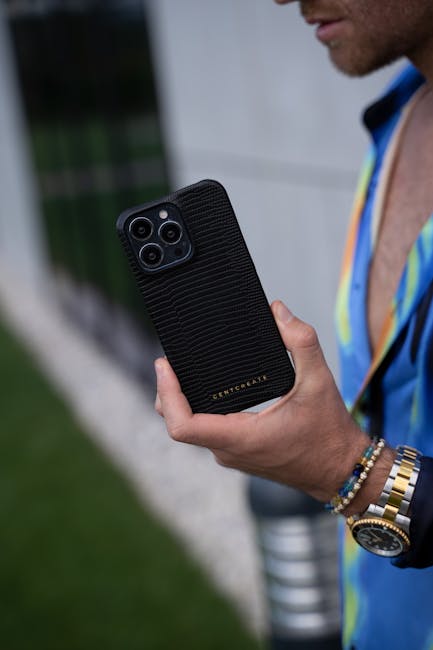 Person holding a mobile device with fitness tech